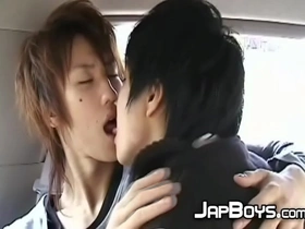 Japanese twinks kissing passionately in the back of the car